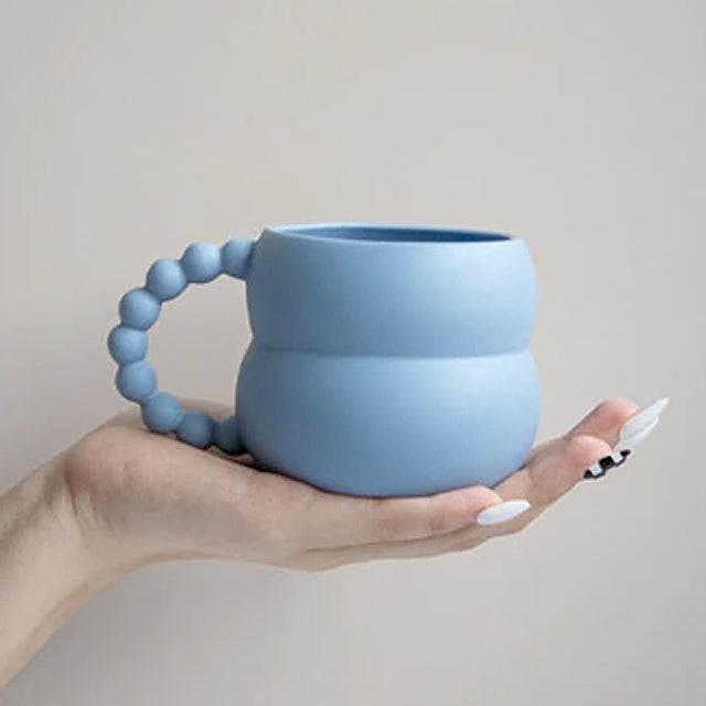 NordicSip - Kaffeebecher mit Bommelgriff